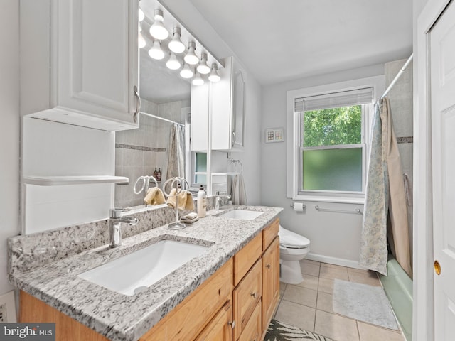 full bath featuring tile patterned flooring, toilet, baseboards, double vanity, and shower / bathtub combination with curtain