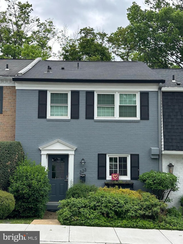 323 Center St N, Vienna, VA 22180 - townhome / multi-family property with brick siding and roof with shingles