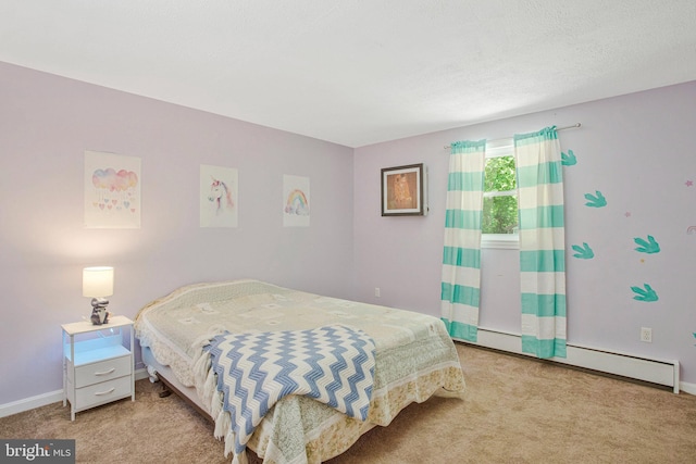 carpeted bedroom featuring baseboard heating and baseboards