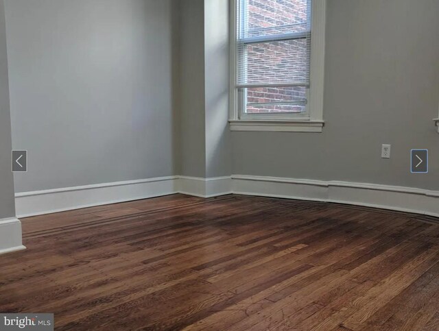 137 S 49th St, Philadelphia, PA 19139 - empty room with dark wood-type flooring and baseboards