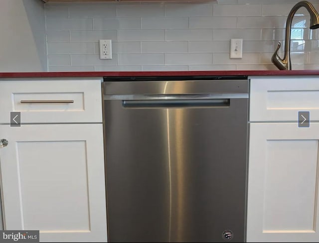 137 S 49th St, Philadelphia, PA 19139 - kitchen view of dishwasher, white cabinetry, backsplash, a sink, and dark countertops