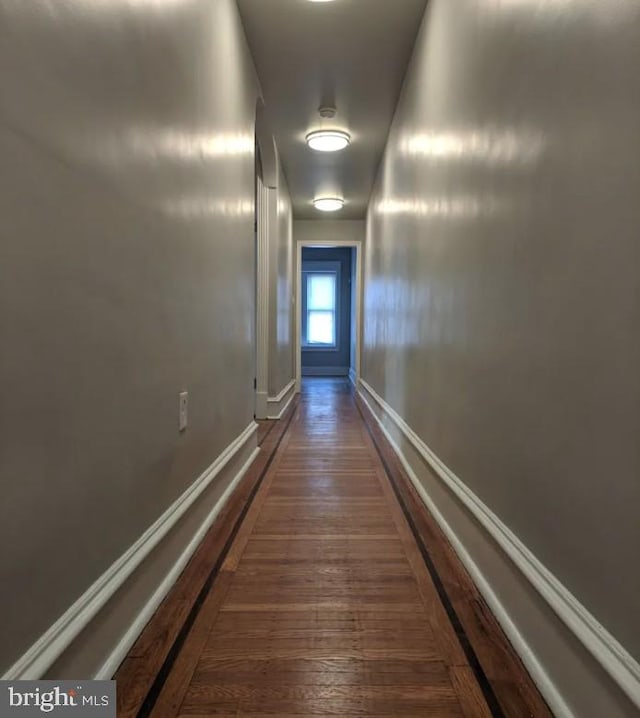 137 S 49th St, Philadelphia, PA 19139 - hallway featuring dark wood-type flooring and baseboards