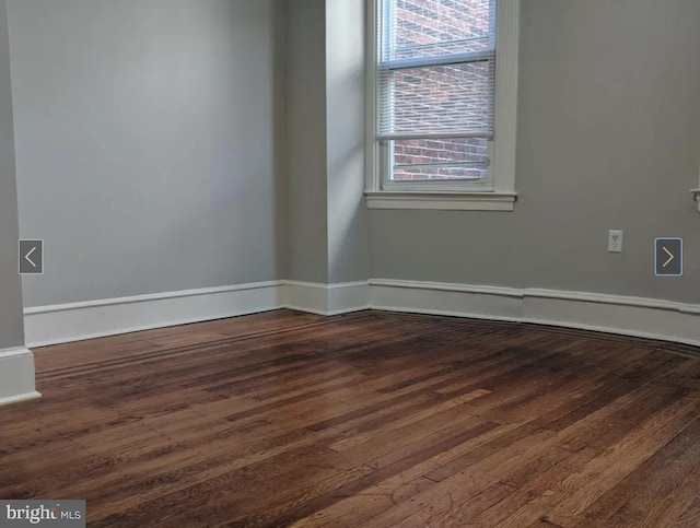 137 S 49th St, Philadelphia, PA 19139 - empty room with dark wood-type flooring and baseboards