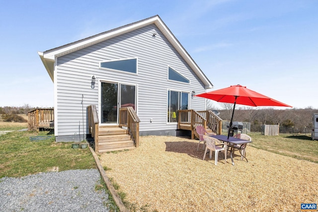 back of property featuring a deck