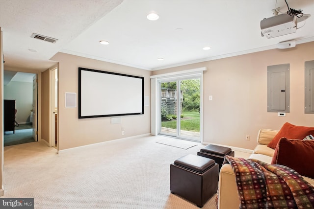 cinema featuring electric panel, light carpet, baseboards, ornamental molding, and recessed lighting