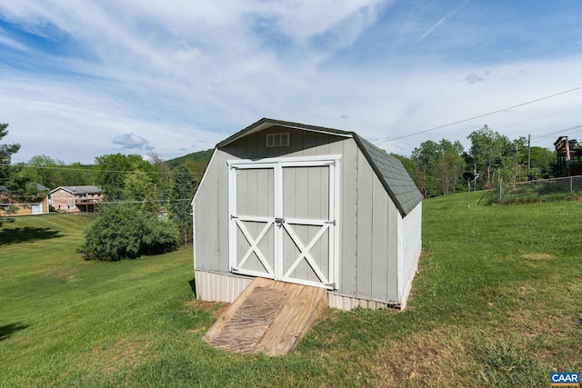 view of shed with fence