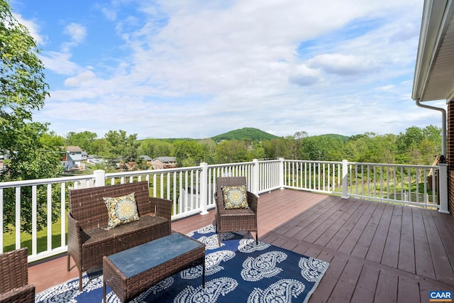wooden deck with an outdoor hangout area