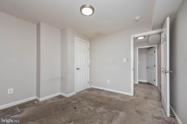 2108 E Hoffman St, Baltimore, MD 21213 - unfurnished bedroom with carpet floors and baseboards