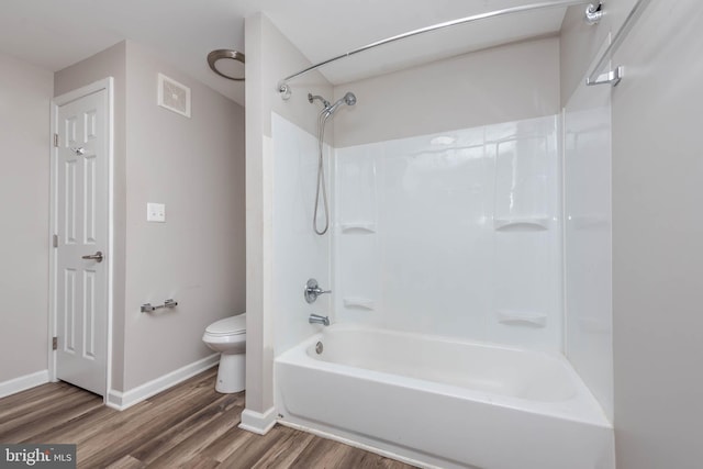 2108 E Hoffman St, Baltimore, MD 21213 - bathroom with toilet, baseboards, visible vents, wood finished floors, and bathing tub / shower combination
