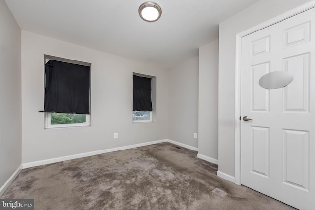 2108 E Hoffman St, Baltimore, MD 21213 - empty room with carpet floors and baseboards