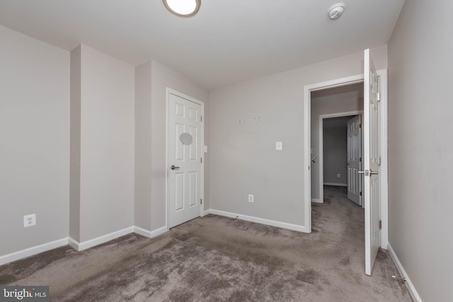 2108 E Hoffman St, Baltimore, MD 21213 - unfurnished bedroom with baseboards and carpet floors