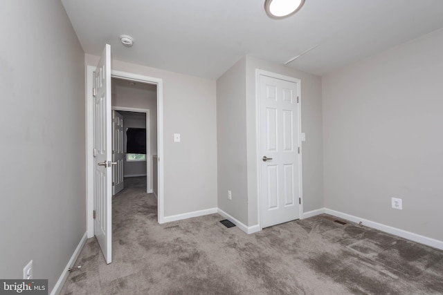 2108 E Hoffman St, Baltimore, MD 21213 - unfurnished bedroom featuring baseboards, visible vents, and carpet