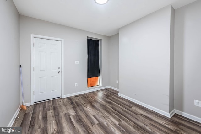 2108 E Hoffman St, Baltimore, MD 21213 - unfurnished room with dark wood-type flooring and baseboards