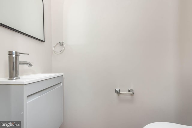 2108 E Hoffman St, Baltimore, MD 21213 - half bathroom featuring toilet and vanity