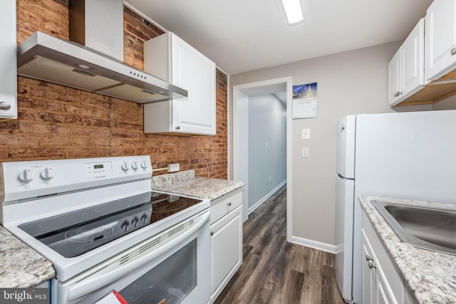 2108 E Hoffman St, Baltimore, MD 21213 - kitchen featuring white cabinets, dark wood finished floors, baseboards, white appliances, and wall chimney range hood