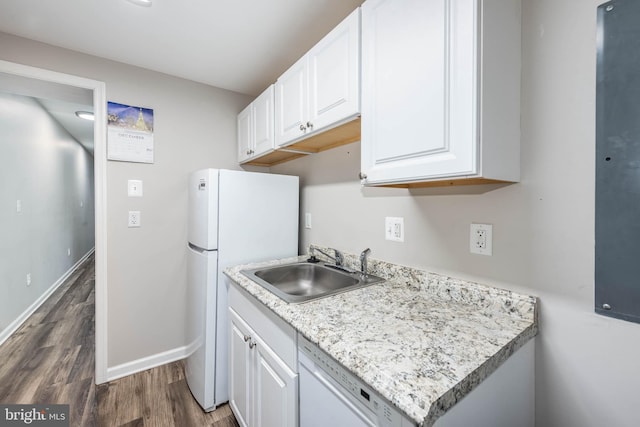 2108 E Hoffman St, Baltimore, MD 21213 - kitchen featuring white cabinetry, white appliances, dark wood-style floors, and a sink
