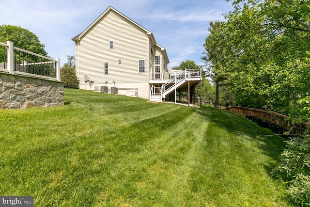 10609 Little Run Farm Ct, Vienna, VA 22182 - back of property with stairway, central AC, and a wooden deck