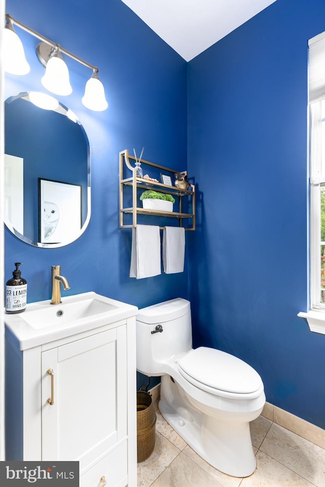 10609 Little Run Farm Ct, Vienna, VA 22182 - half bathroom with toilet, tile patterned flooring, vanity, and baseboards