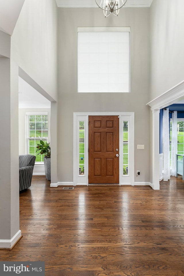 10609 Little Run Farm Ct, Vienna, VA 22182 - foyer entrance featuring a high ceiling, plenty of natural light, wood finished floors, ornamental molding, and a chandelier