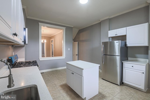 2014 Penrose Ave, Baltimore, MD 21223 - kitchen featuring stainless steel appliances, a sink, white cabinetry, ornamental molding, and a kitchen island