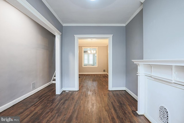 2014 Penrose Ave, Baltimore, MD 21223 - hall featuring dark wood finished floors, baseboards, and crown molding