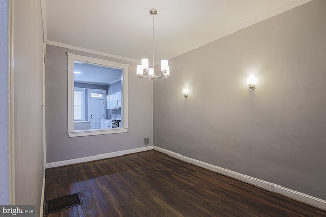 2014 Penrose Ave, Baltimore, MD 21223 - empty room with crown molding, dark wood-type flooring, baseboards, and a chandelier