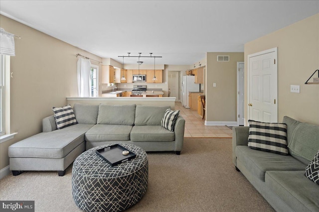 living room with light colored carpet and baseboards