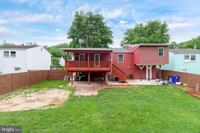 rear view of property with a patio, a wooden deck, stairs, and a gate