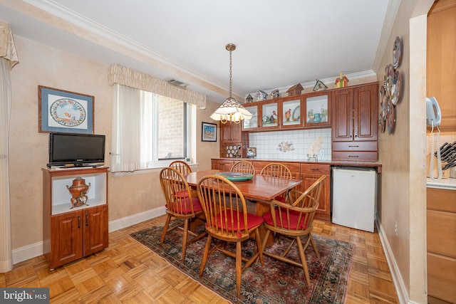 1655 Oakwood Dr Unit N323, Narberth, PA 19072 - dining area featuring baseboards, crown molding, and a chandelier