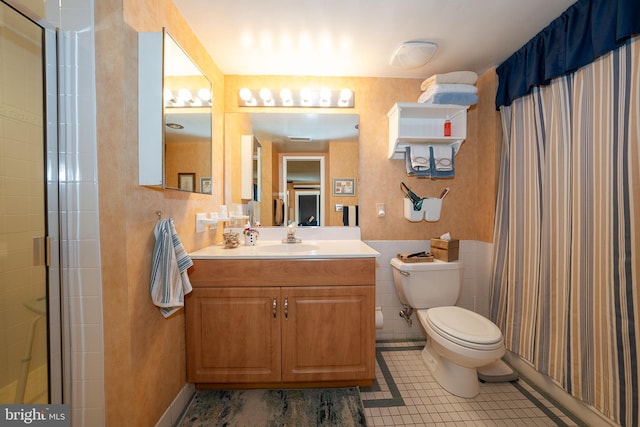 1655 Oakwood Dr Unit N323, Narberth, PA 19072 - full bath with toilet, vanity, tile patterned flooring, a shower with shower curtain, and tile walls