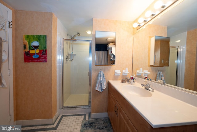 1655 Oakwood Dr Unit N323, Narberth, PA 19072 - bathroom with baseboards, vanity, tile patterned floors, and a stall shower