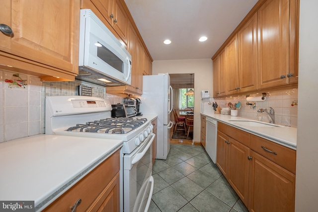 1655 Oakwood Dr Unit N323, Narberth, PA 19072 - kitchen featuring white appliances, a sink, decorative backsplash, light countertops, and recessed lighting