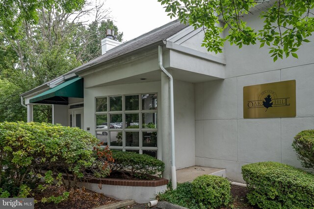 1655 Oakwood Dr Unit N323, Narberth, PA 19072 - property entrance featuring a chimney