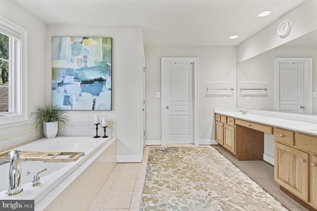 bathroom with tile patterned floors, a whirlpool tub, vanity, recessed lighting, and baseboards