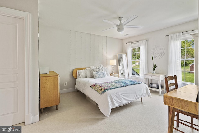 bedroom featuring carpet flooring, baseboards, and a ceiling fan