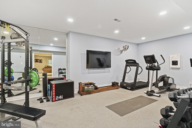 exercise area featuring recessed lighting and baseboards