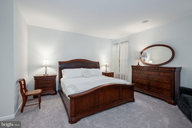 bedroom with carpet and baseboards