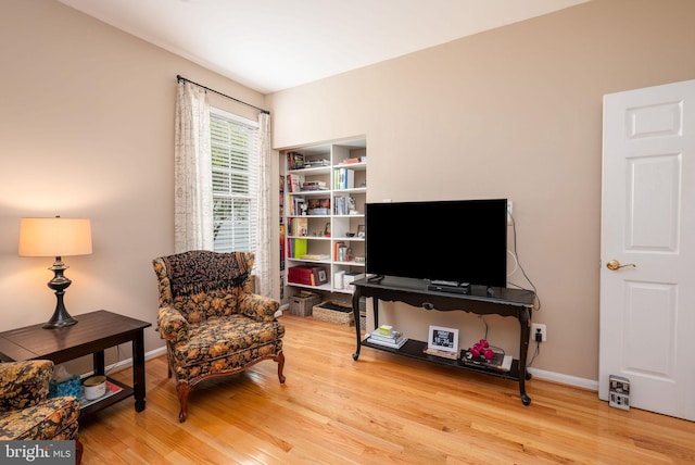 sitting room featuring wood finished floors and baseboards