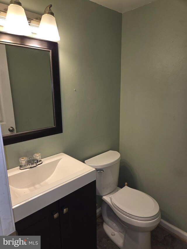 1850 Aberdeen Cir, Crofton, MD 21114 - bathroom with toilet, vanity, and baseboards