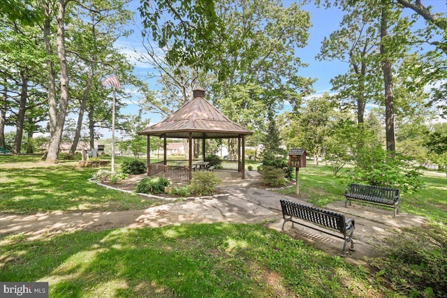 view of property's community with a gazebo and a lawn