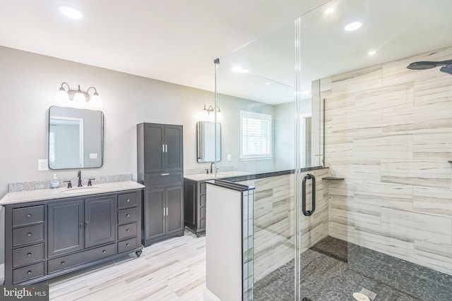 7290 Southern Maryland Blvd, Owings, MD 20736 - bathroom with a shower stall, recessed lighting, two vanities, and wood finished floors