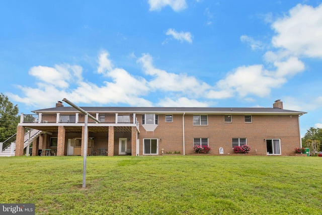 7290 Southern Maryland Blvd, Owings, MD 20736 - back of property with a chimney, brick siding, a lawn, and stairway
