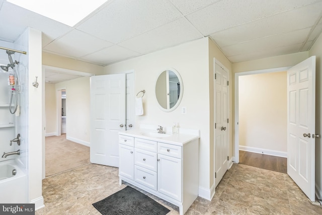 7290 Southern Maryland Blvd, Owings, MD 20736 - full bathroom featuring a paneled ceiling, vanity, shower / bath combination, and baseboards