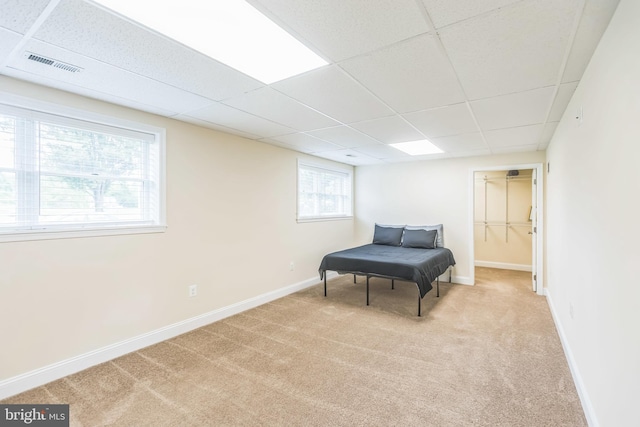 7290 Southern Maryland Blvd, Owings, MD 20736 - living area featuring light colored carpet, a paneled ceiling, and baseboards