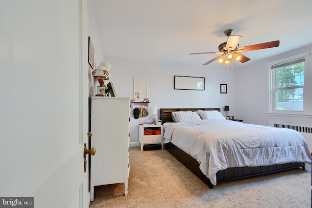 409 Academy Rd, Baltimore, MD 21228 - carpeted bedroom featuring radiator heating unit and ceiling fan