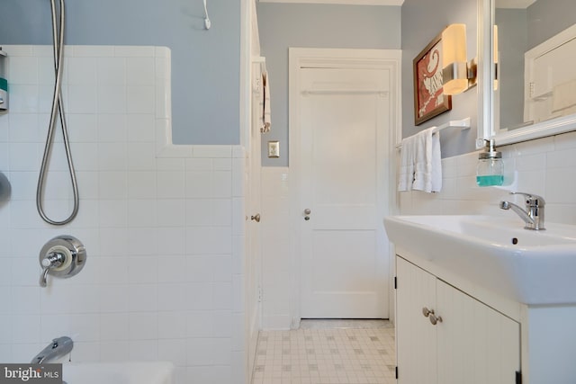 409 Academy Rd, Baltimore, MD 21228 - full bath featuring tile walls, vanity, bathing tub / shower combination, and a wainscoted wall