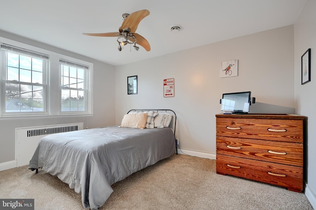 409 Academy Rd, Baltimore, MD 21228 - carpeted bedroom featuring radiator heating unit, baseboards, and ceiling fan