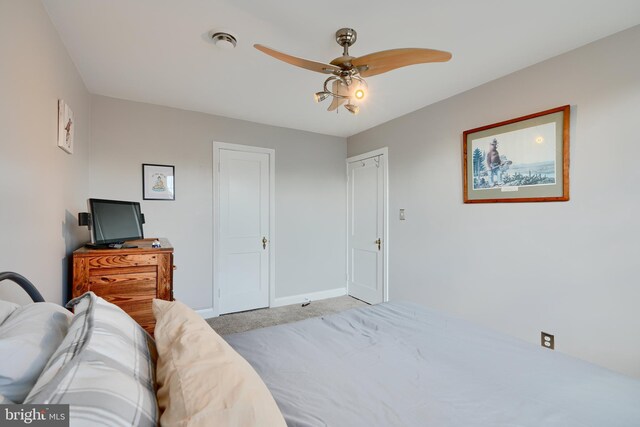 409 Academy Rd, Baltimore, MD 21228 - bedroom featuring light colored carpet, baseboards, and a ceiling fan