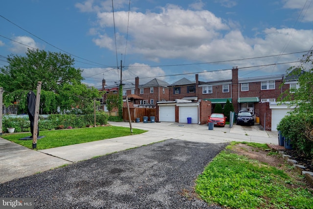 409 Academy Rd, Baltimore, MD 21228 - view of front of home featuring brick siding, a front yard, and a residential view