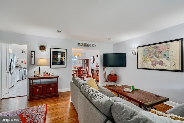 409 Academy Rd, Baltimore, MD 21228 - living area with light wood finished floors and baseboards